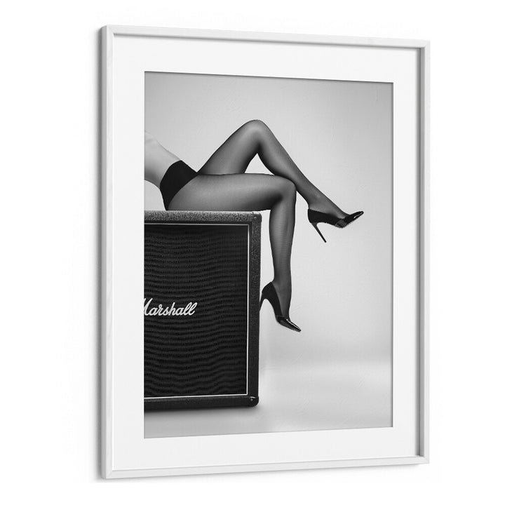 Stylish legs in high heels against a Marshall amp, showcasing "ROCK N LEGS, PHOTOGRAPHY PRINTS" by David Drake.