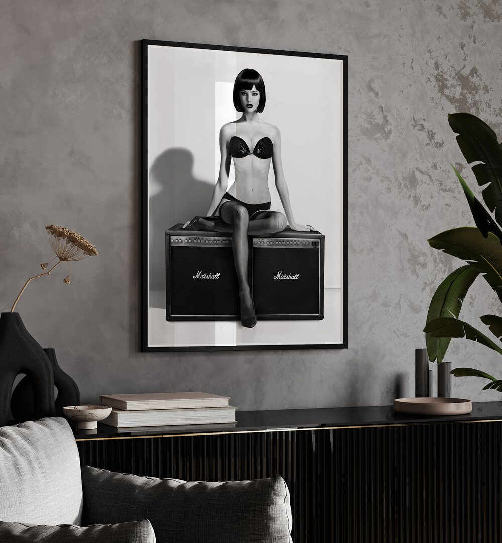 Stylish black and white art featuring a model on amplifiers, perfect for your collection of ROCK THIS, PHOTOGRAPHY PRINTS.