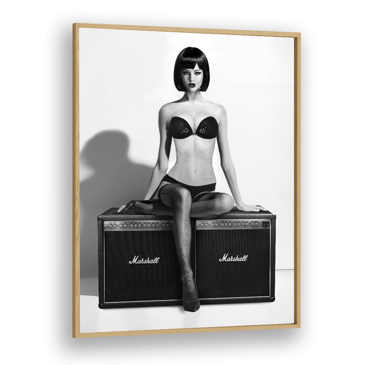 Stylish model poses on amplifiers in "Rock This" photography prints by David Drake, blending fashion and art.