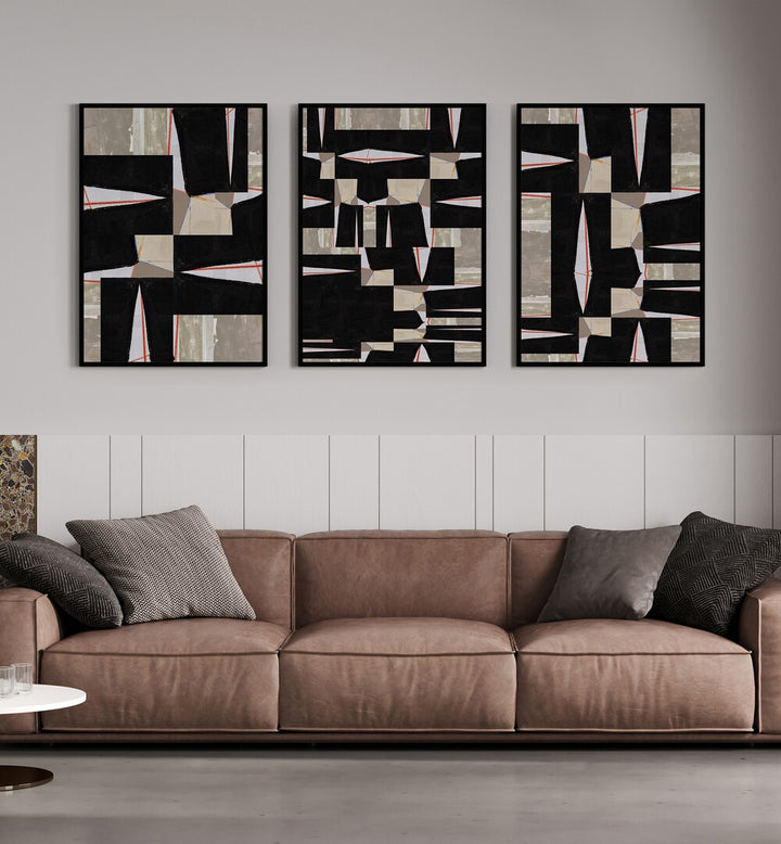 Stylishly arranged BLACK JIGSAW SET, SET OF 3 PAINTINGS enhancing modern living spaces with artistic flair.