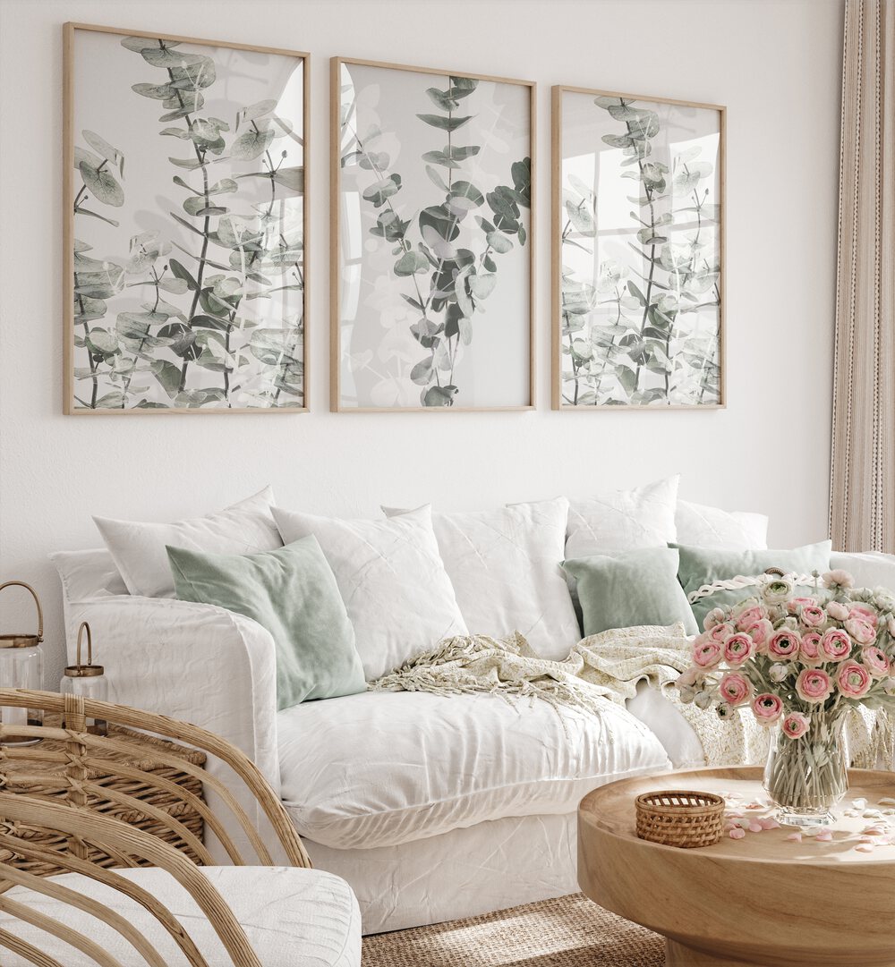 Stylish living room featuring the TRANQUIL EUCALYPTUS SET, SET OF 3 PAINTINGS, enhancing natural serenity at home.