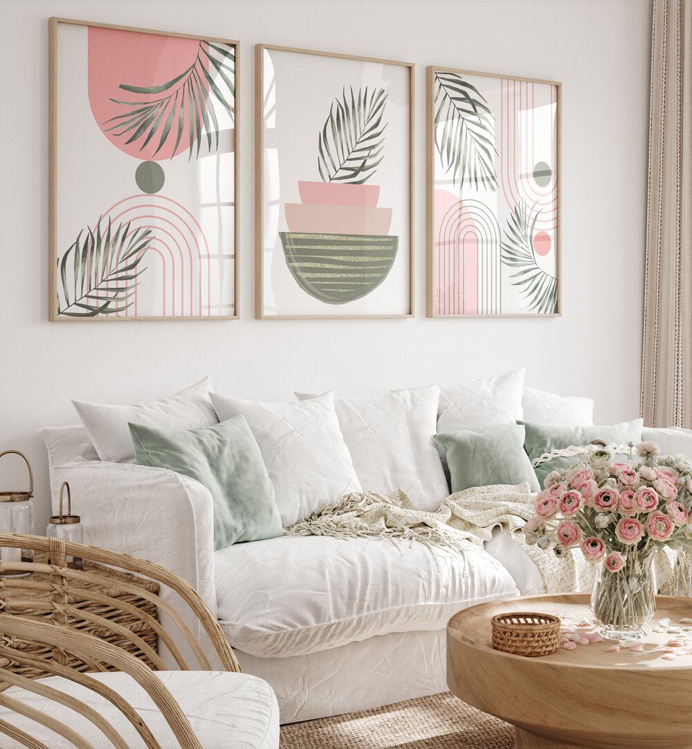 Elegant living room featuring the SIMPLICITY IN PINK SET, SET OF 3 PAINTINGS, enhancing home decor with charm.