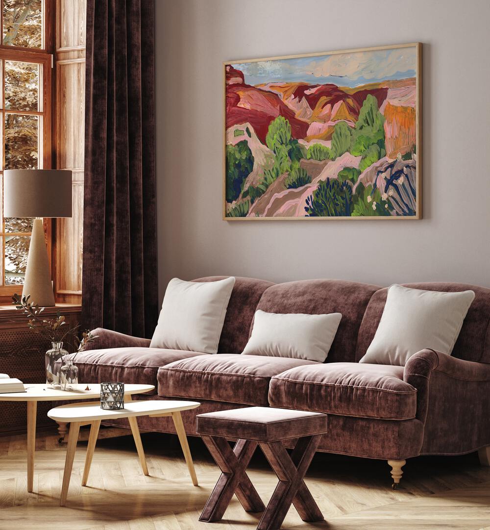 Elegant SOUTH WESTERN SKY, LANDSCAPE PAINTINGS adorn a cozy living room, enhancing its vibrant ambiance.