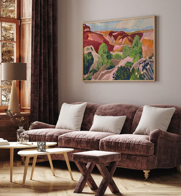Elegant SOUTH WESTERN SKY, LANDSCAPE PAINTINGS adorn a cozy living room, enhancing its vibrant ambiance.