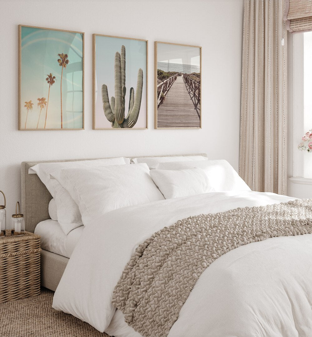 Enhance your decor with the SUNNY CALI SAGUARO SET, SET OF 3 PAINTINGS showcasing vibrant cacti and sunsets.