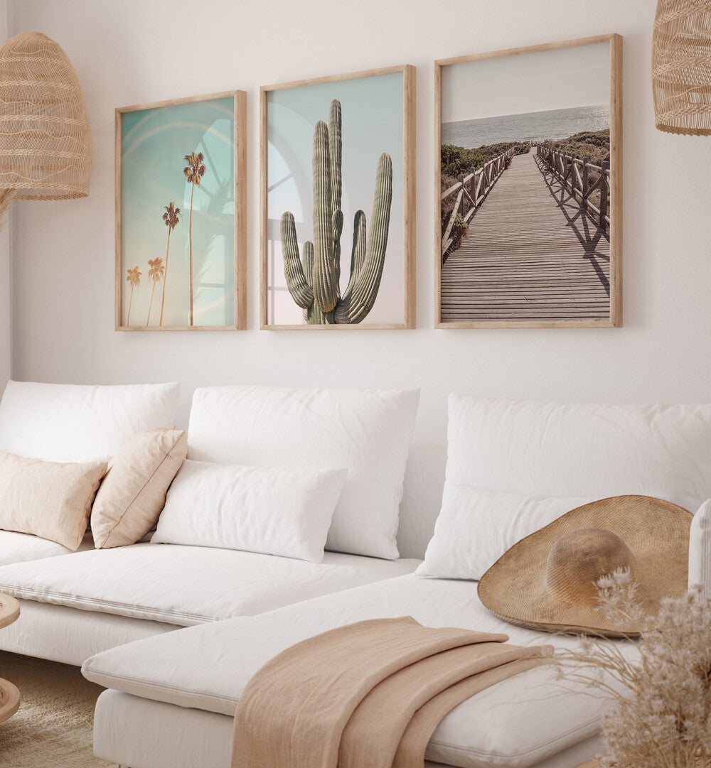 Transform your space with the SUNNY CALI SAGUARO SET, SET OF 3 PAINTINGS showcasing vibrant saguaro cacti.
