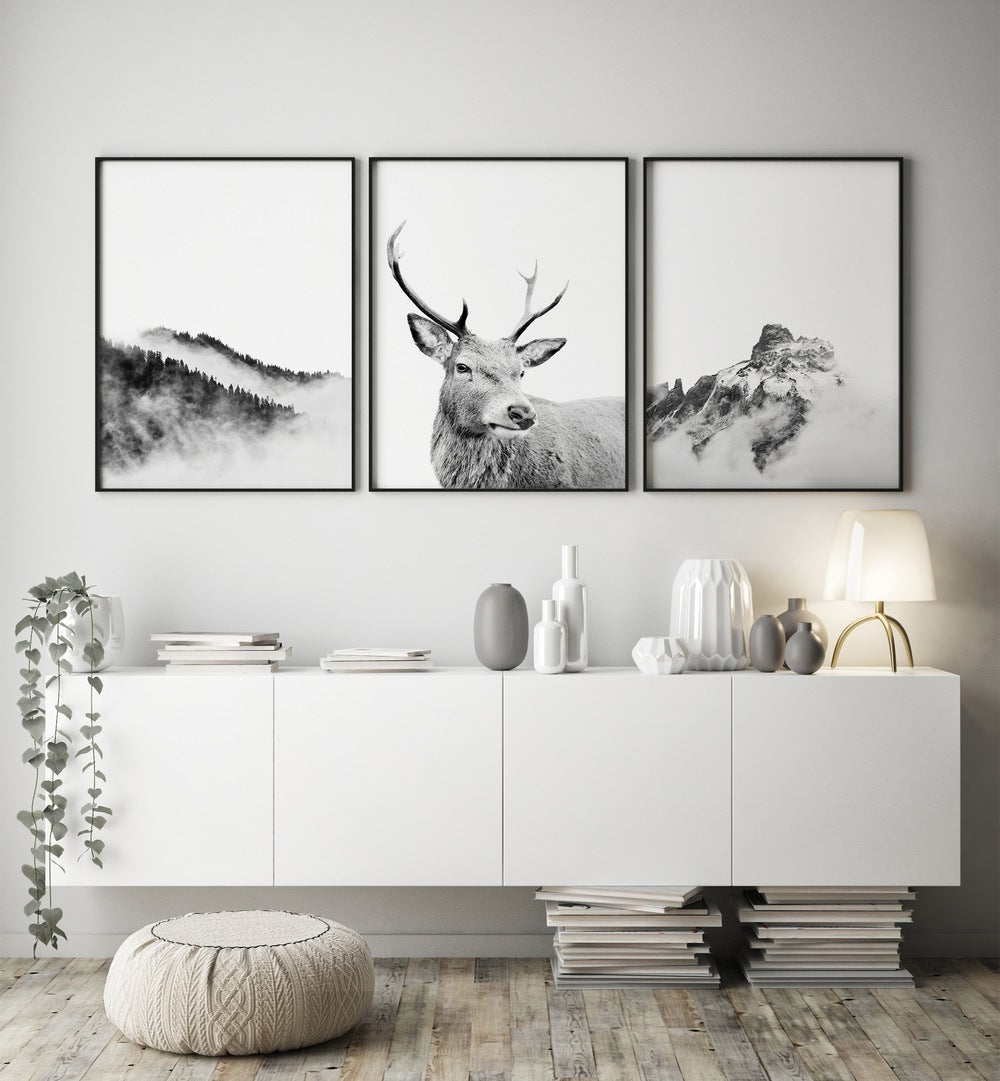 Elevate your decor with the SNOW FOREST, SET OF 3 PAINTINGS featuring serene winter landscapes and majestic reindeer.