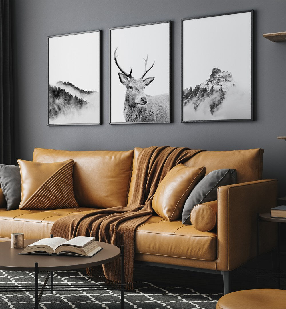 Enhance your space with the SNOW FOREST, SET OF 3 PAINTINGS featuring majestic reindeer in serene winter landscapes.
