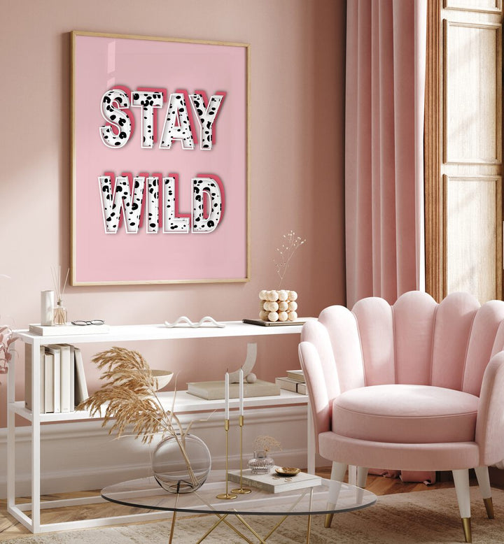 Bright pink wall featuring "STAY WILD, FASHION POSTERS" artwork by Martina, perfect for stylish home decor.