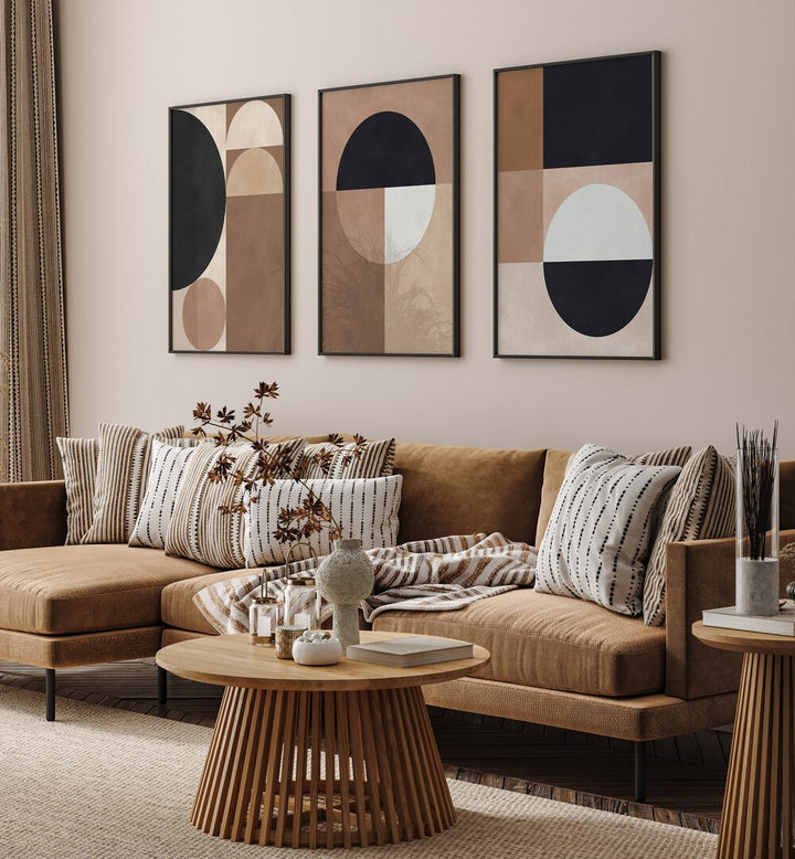 Stylish living room showcasing the TERRA SHAPES SET, SET OF 3 PAINTINGS with earthy tones and modern design.