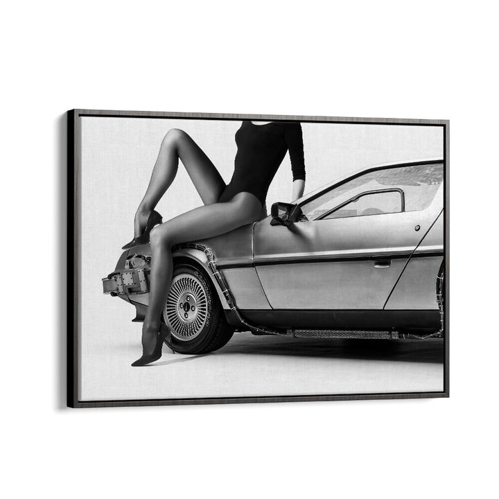 Stylish black and white photography print featuring a model on a classic car, representing "THE FUTURE IS FEMALE PART III, PHOTOGRAPHY PRINTS."