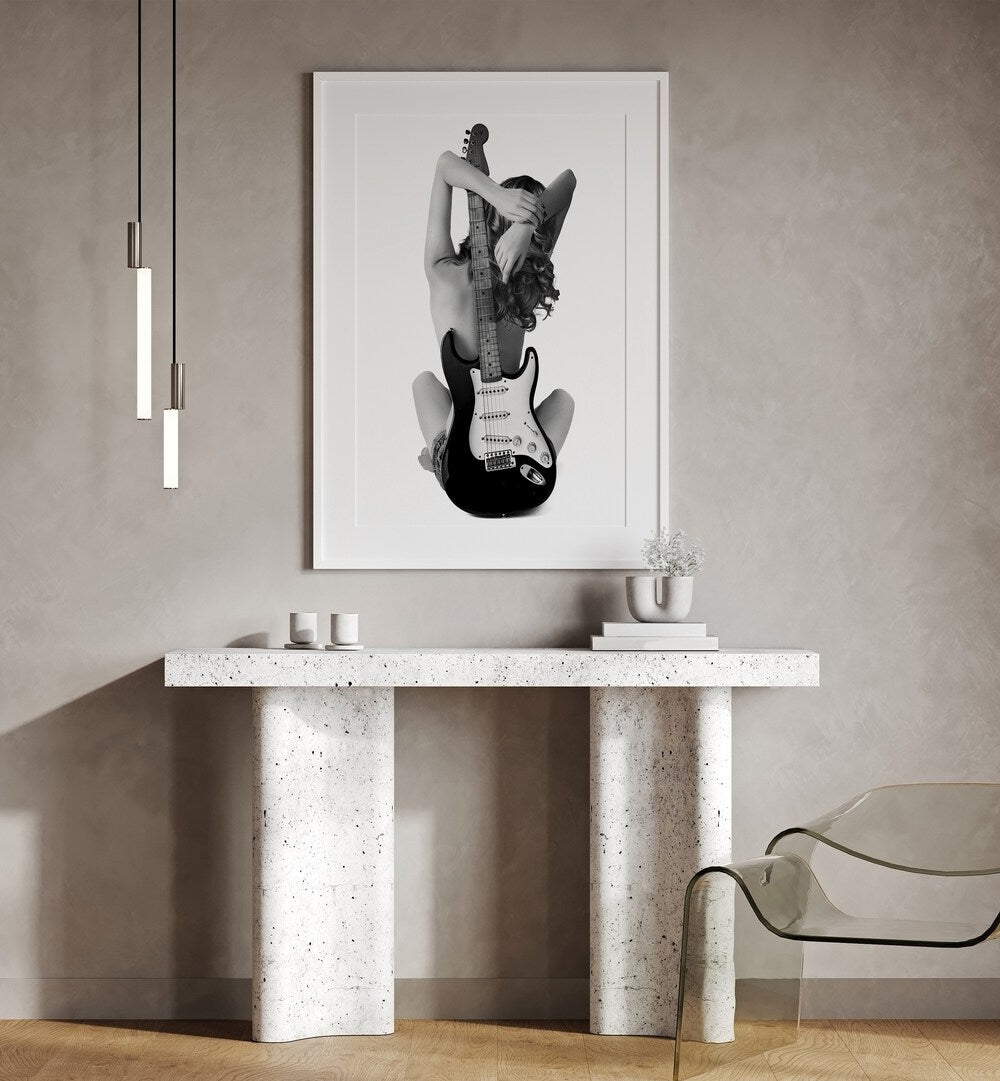 Stylish interior featuring "THE STRAT, PHOTOGRAPHY PRINTS" by David Drake, blending music and fashion in art.