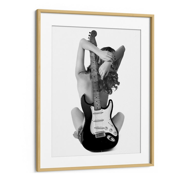 "The Strat, photography prints" showcases a striking black-and-white artwork by David Drake, blending music and fashion.