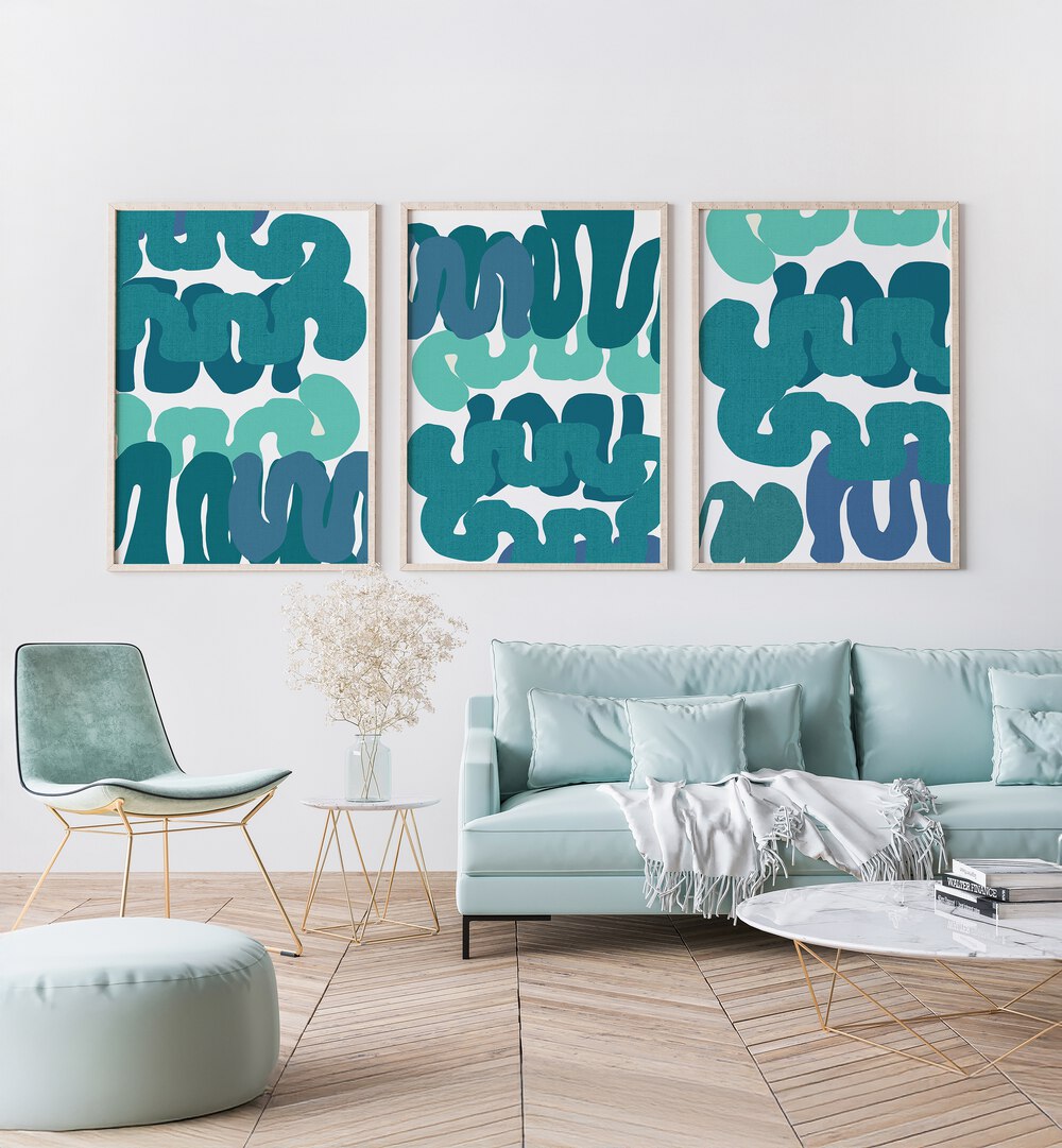 Stylish living space featuring TIDAL RHYTHM SET, SET OF 3 PAINTINGS, evoking ocean tranquility and elegance.