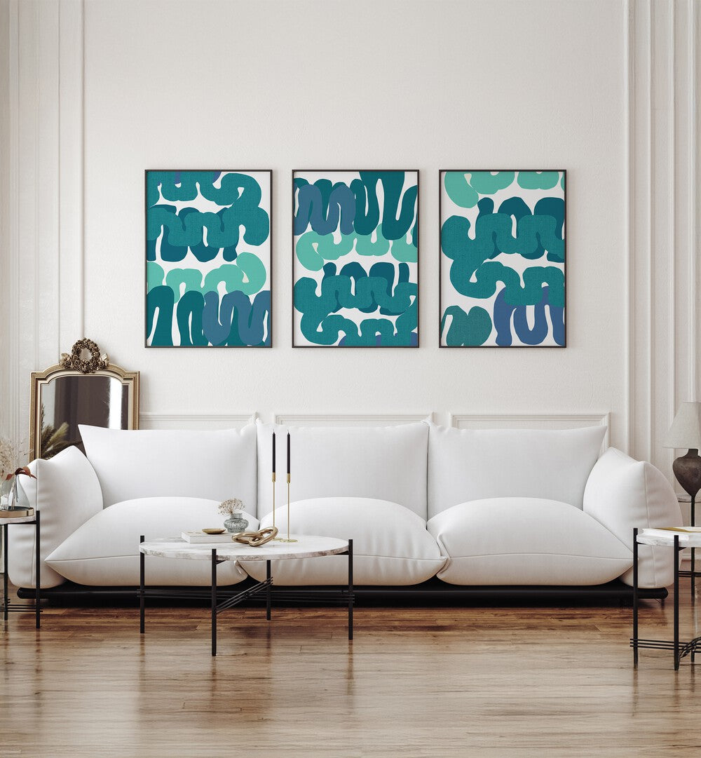 Elegant living room featuring the TIDAL RHYTHM SET, SET OF 3 PAINTINGS, showcasing ocean-inspired tranquility.