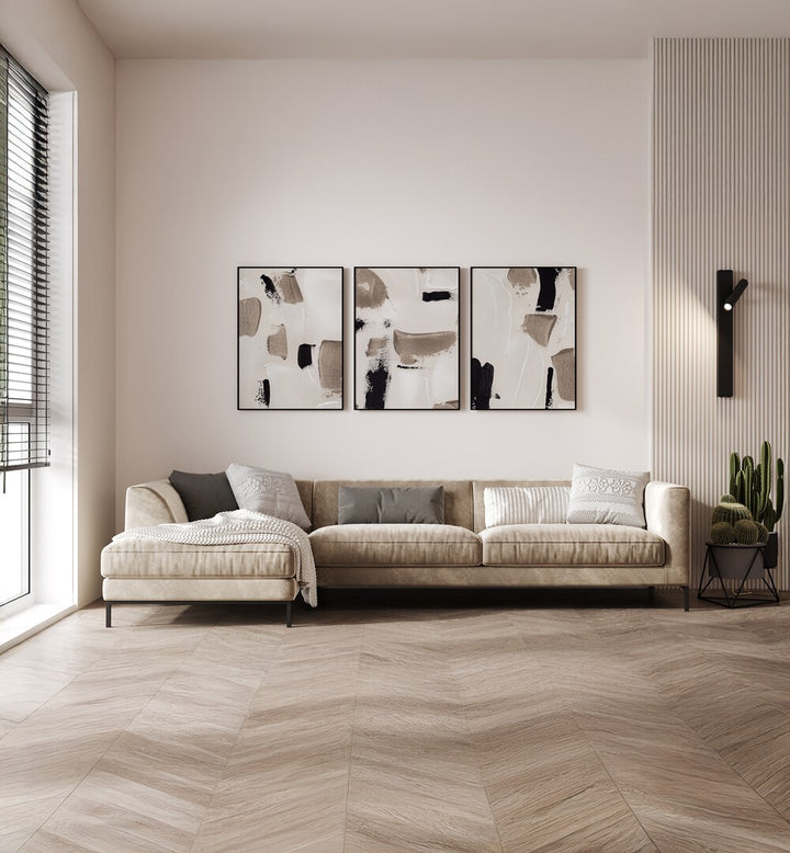 Stylish living room featuring the TIMELESS TEXTURE SET, SET OF 3 PAINTINGS that enhance any decor effortlessly.