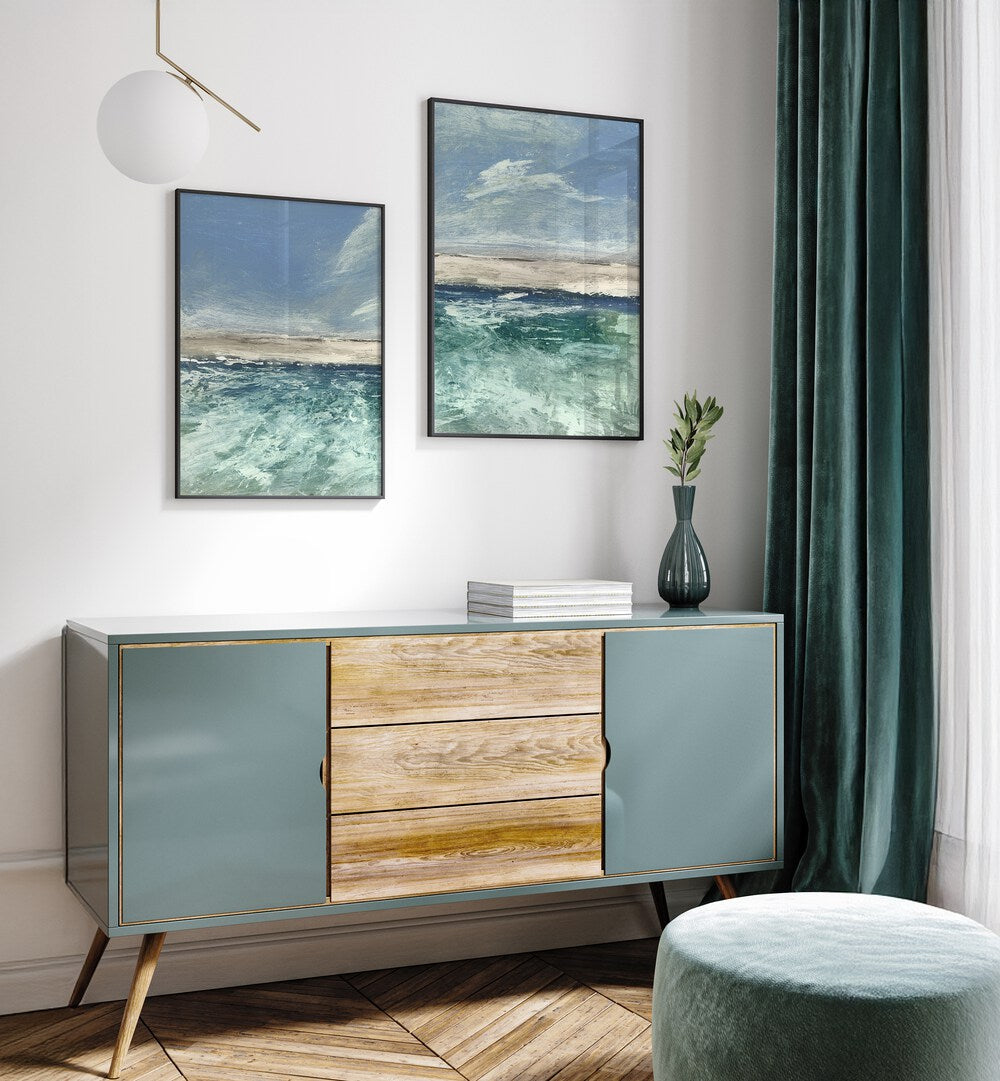 Enhance your decor with the VOYAGE SET, SET OF 2 PAINTINGS, featuring serene abstract seascapes in calming blues.