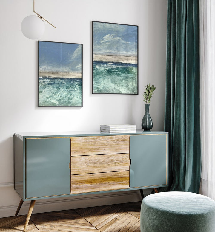 Enhance your decor with the VOYAGE SET, SET OF 2 PAINTINGS, featuring serene abstract seascapes in calming blues.