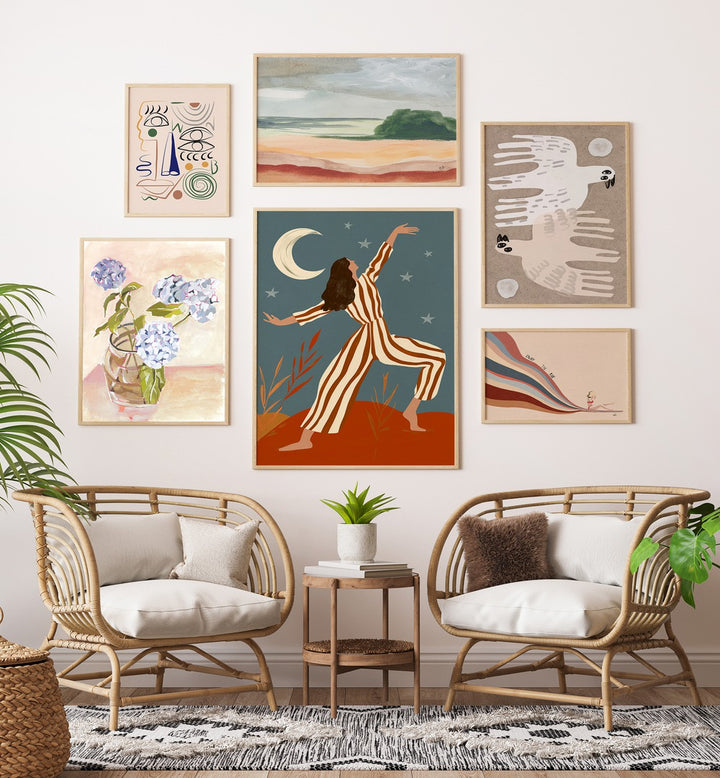 Stylish WANDERER’S MUSE GALLERY WALL from Asian Monk features dreamy art celebrating travel and self-discovery.