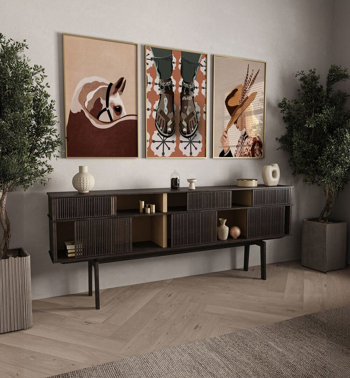 Stylish living room featuring the WESTERN SOUL SET, SET OF 3 PAINTINGS, capturing Wild West spirit and vibrant colors.