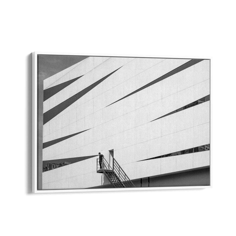 Modern architectural scene featuring a figure, showcasing UNTITLED IX, PHOTOGRAPHY PRINTS that capture urban life.