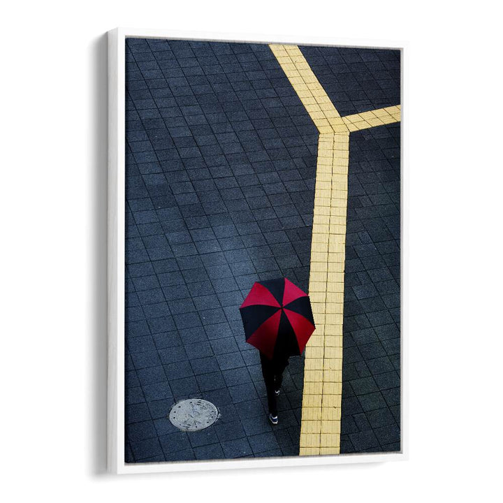 Urban scene captured in Y, PHOTOGRAPHY PRINTS, featuring a person with a red umbrella on a city sidewalk.