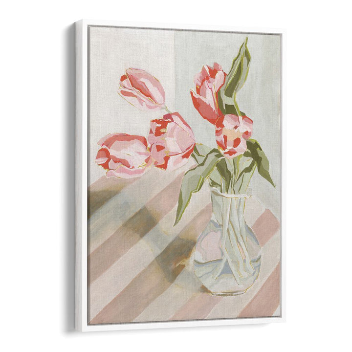 Bright pink tulips in a clear vase, adding elegance to any space with our TULIPS IN A VASE floral arrangement.