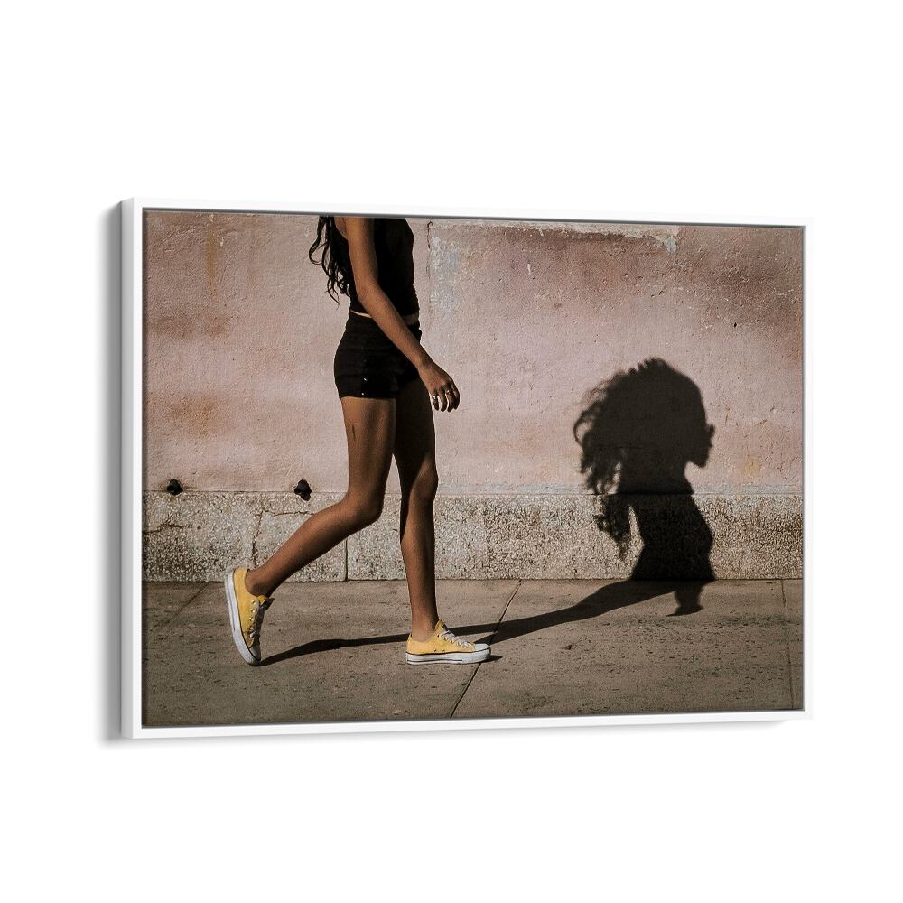 SHADOW, PHOTOGRAPHY PRINTS showcase a figure walking, casting a striking shadow on a textured wall.