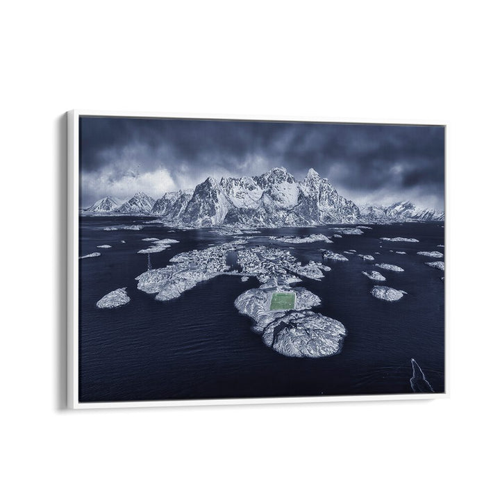 Stunning HENNINGSVABR photography prints showcasing a breathtaking snowy landscape with serene waters and mountains.