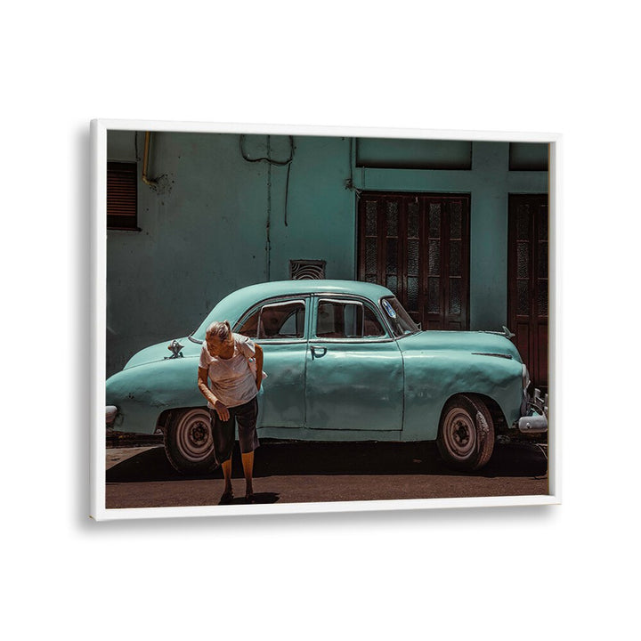 A woman interacts with a classic car on the street, showcasing PASSING STREET, PHOTOGRAPHY PRINTS.