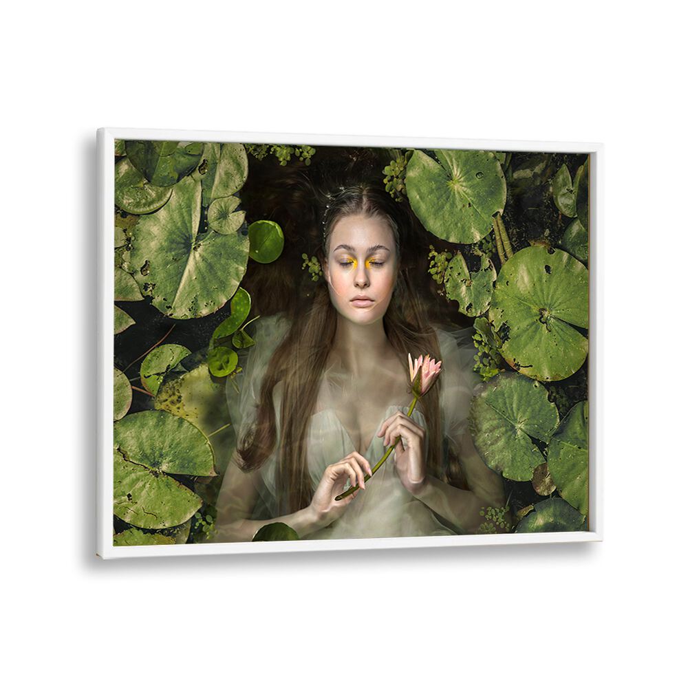 Serene woman in water surrounded by lily pads, showcasing SILENT DREAM, PHOTOGRAPHY PRINTS for surreal art lovers.