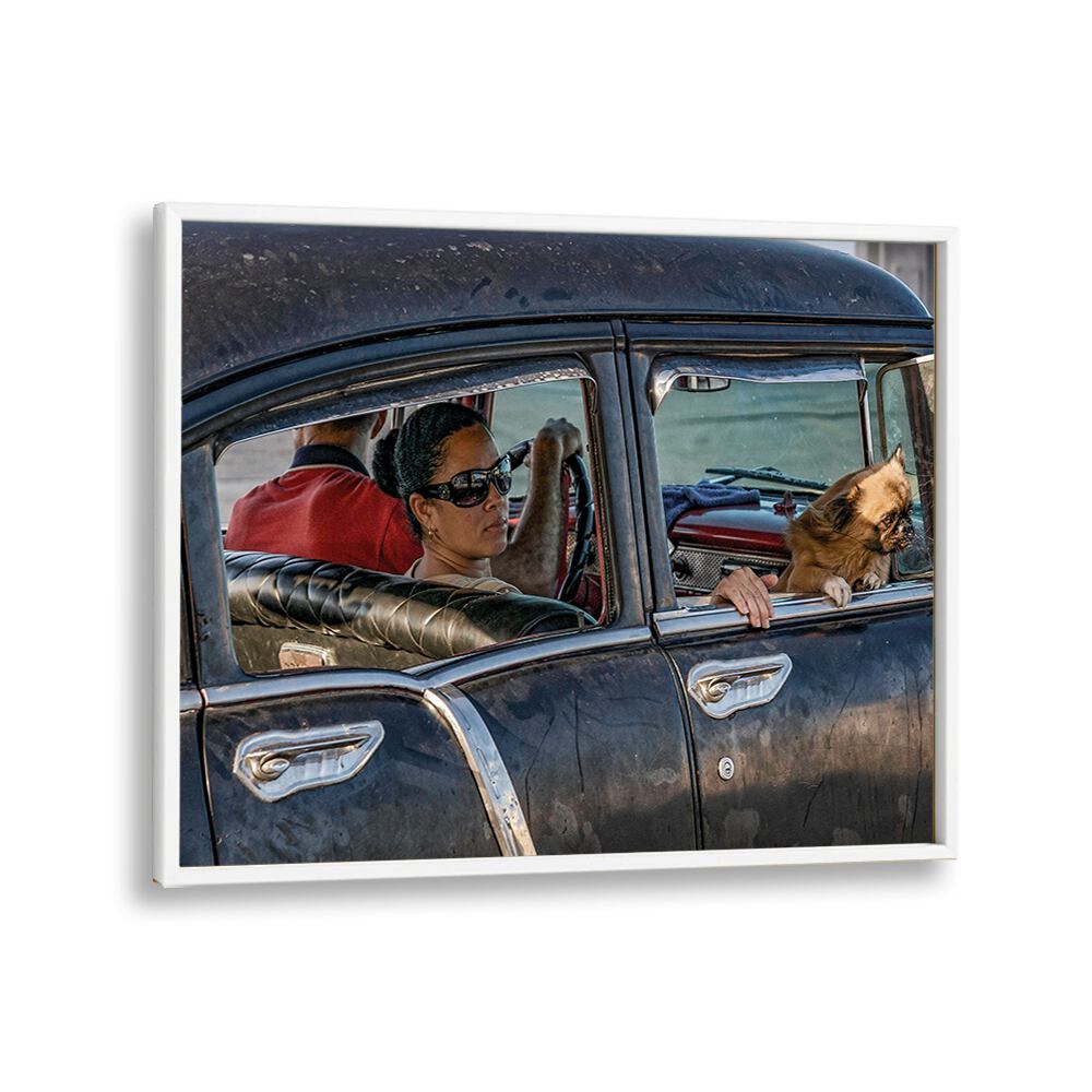 Experience urban life with MALECON II, PHOTOGRAPHY PRINTS showcasing a woman and dog in a vintage car.