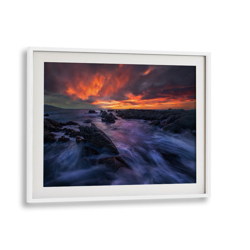Stunning BURNING SKY, PHOTOGRAPHY PRINTS showcasing vibrant sunset over rocky shoreline, perfect for nature lovers.