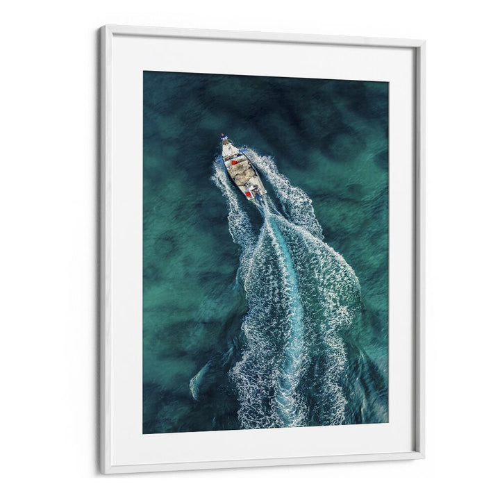 AERIAL PURSUIT, PHOTOGRAPHY PRINTS showcase a vibrant aerial view of a boat creating waves on turquoise water.