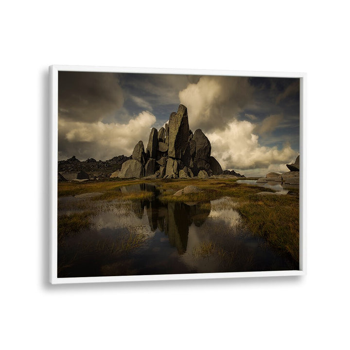 Majestic rock formation reflected in water, featured in STANDING ALONE, PHOTOGRAPHY PRINTS for nature lovers.
