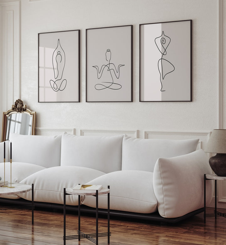 Elevate your decor with the YOGA LINE ART SET, SET OF 3 PAINTINGS showcasing elegant minimalist yoga poses.