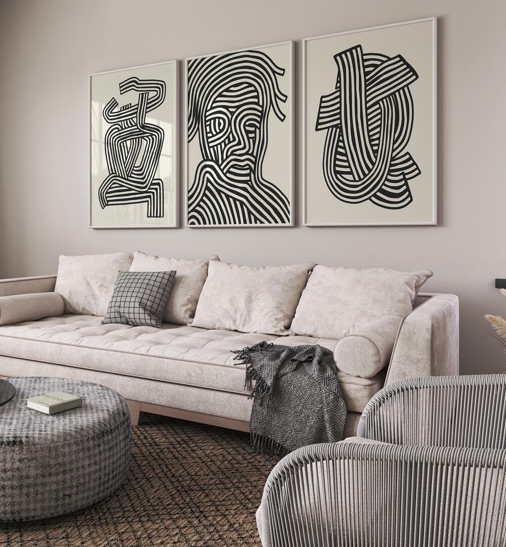 Stylish living room featuring the ABSTRACT LINES INFINITY, SET OF 3 PAINTINGS for a sophisticated touch.