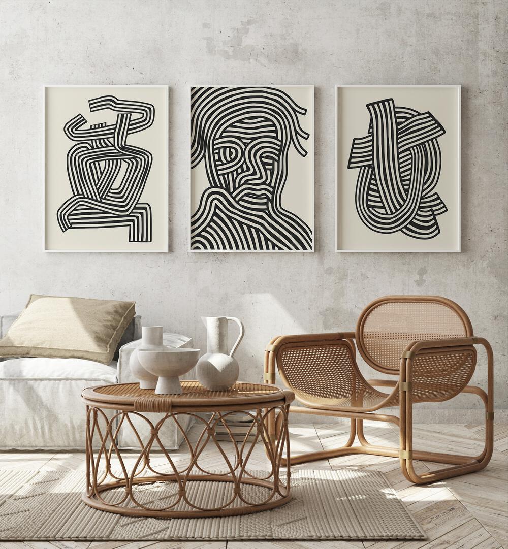 Stylish living room featuring ABSTRACT LINES INFINITY, SET OF 3 PAINTINGS that elevate modern decor with sophistication.