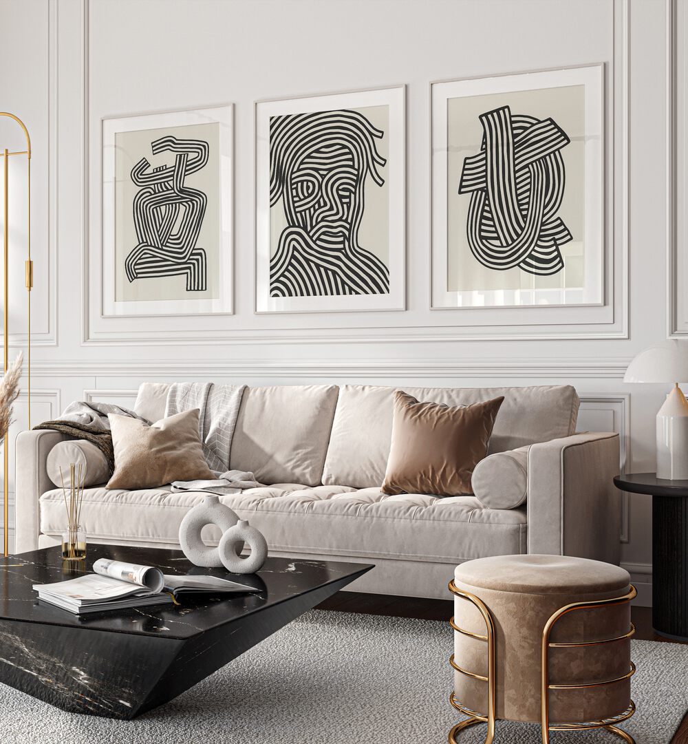 Sophisticated living room featuring the ABSTRACT LINES INFINITY, SET OF 3 PAINTINGS in elegant frames.