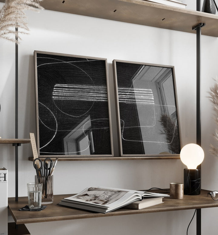 Stylish ABSTRACTION BLACK SET, SET OF 2 PAINTINGS displayed on a shelf, enhancing modern living spaces beautifully.