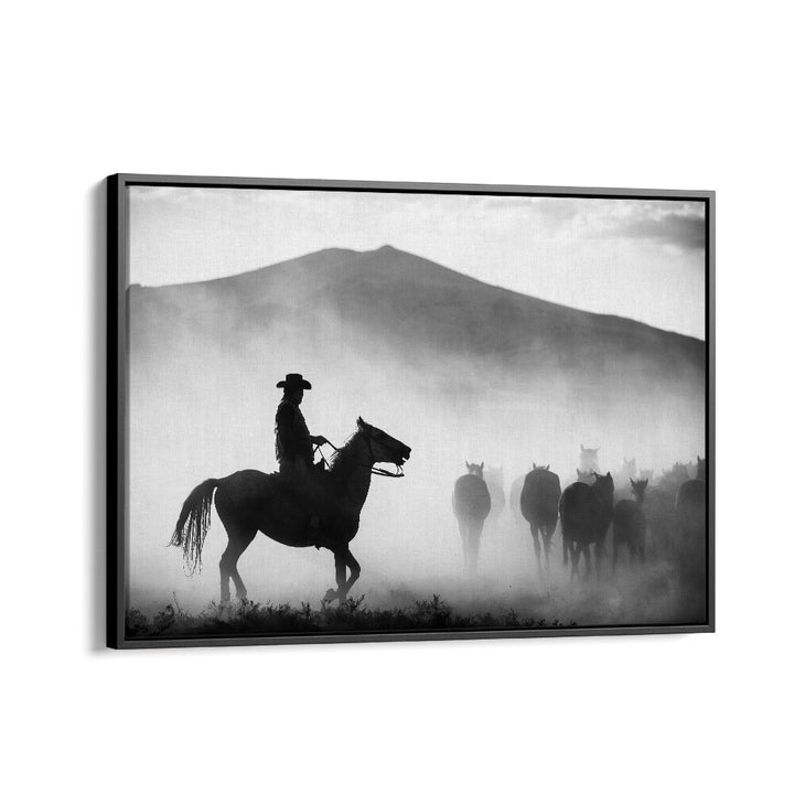 A cowboy on horseback leads a herd through foggy mountains in "HIS TERRITORY! , PHOTOGRAPHY PRINTS" collection.
