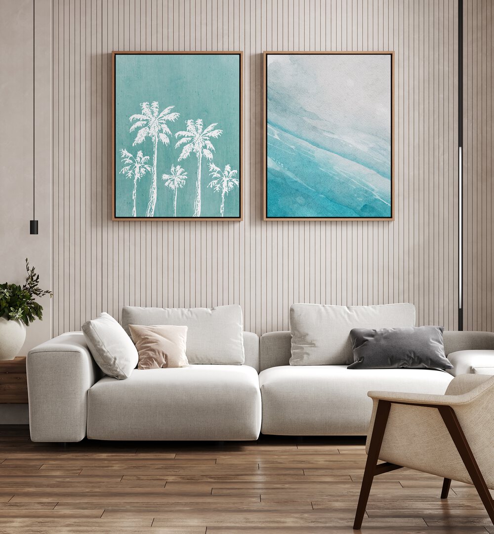 Transform your space with the BLUE OCEANIC SET, SET OF 2 PAINTINGS showcasing tranquil ocean and palm tree designs.