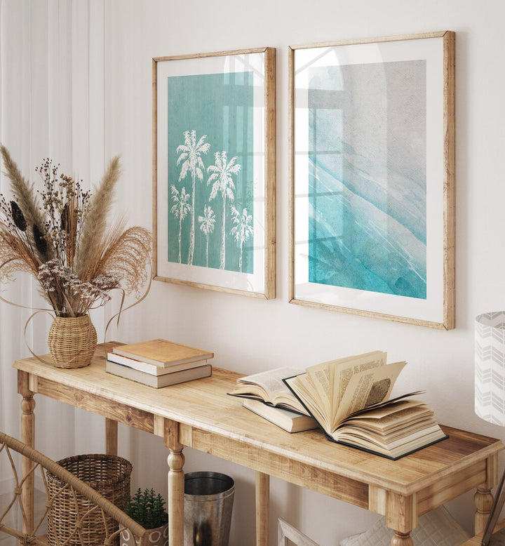 Enhance your decor with the BLUE OCEANIC SET, SET OF 2 PAINTINGS showcasing serene palm trees and ocean views.