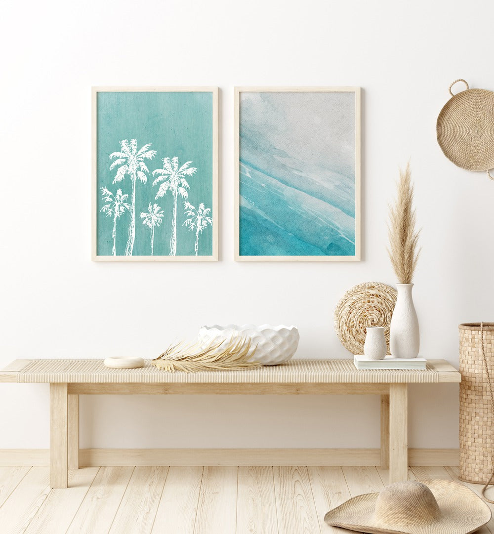 Transform your space with the BLUE OCEANIC SET, SET OF 2 PAINTINGS featuring serene palm trees and a blue ocean backdrop.