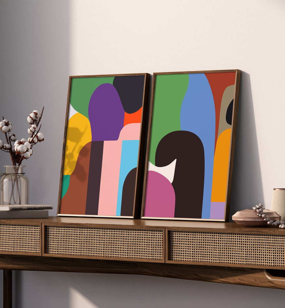 Brighten your decor with the COLOURFUL PEOPLE, SET OF 2 PAINTINGS, featuring vibrant abstract art for any space.