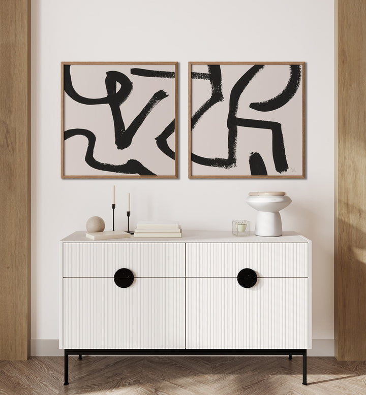 Bold black brush strokes on white create the CURVY LINES SET, SET OF 2 PAINTINGS, perfect for modern decor.