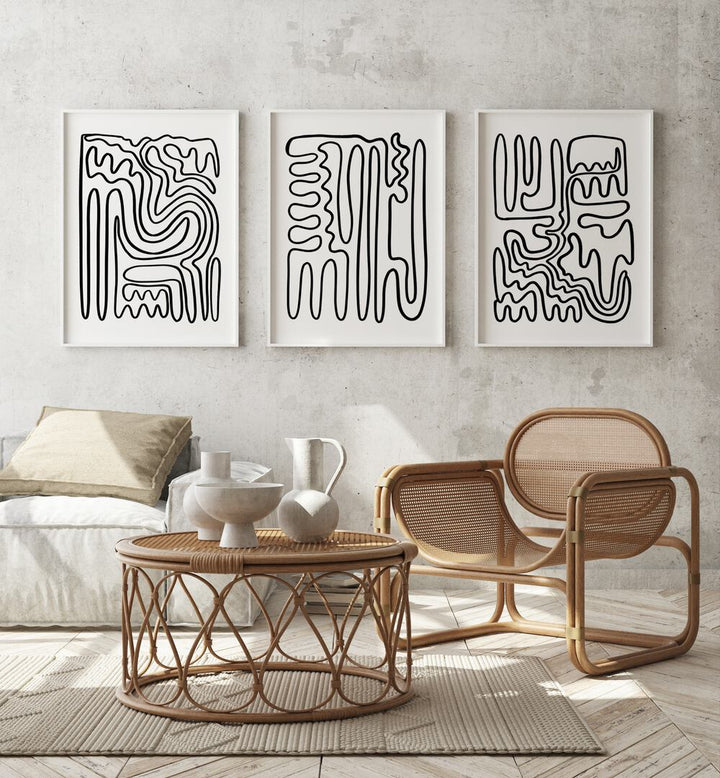 Stylish living room featuring DOODLE ART, SET OF 3 PAINTINGS, enhancing contemporary bohemian decor.