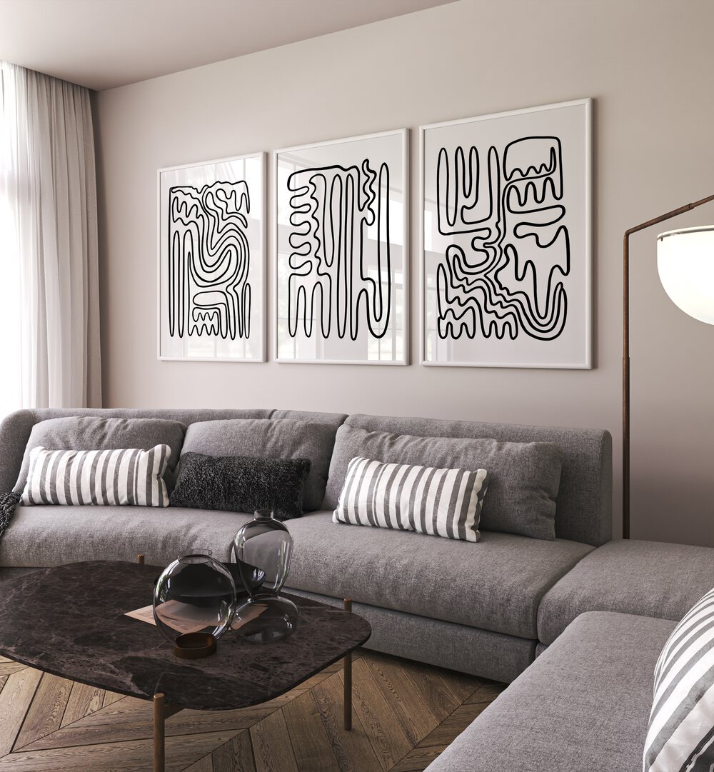 Stylish living room featuring the modern DOODLE ART, SET OF 3 PAINTINGS for a chic, bohemian touch.