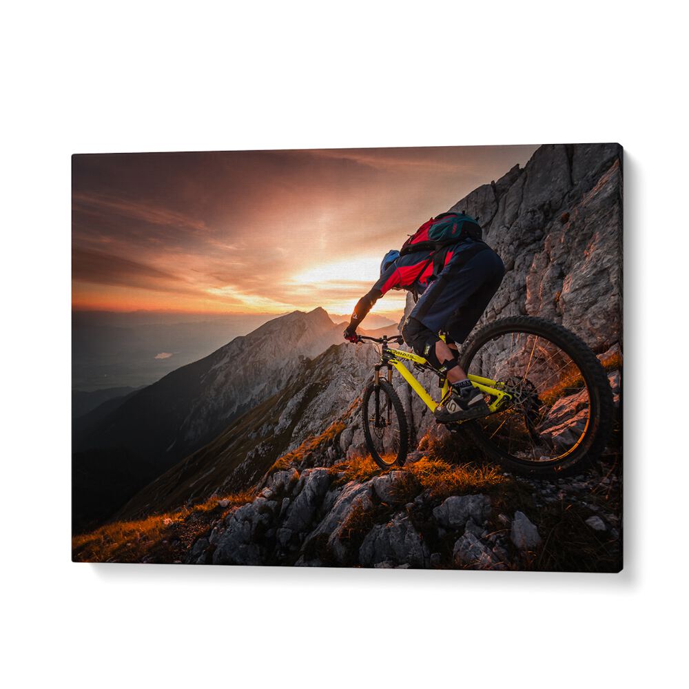 Mountain biker navigating rocky terrain at sunset in GOLDEN HOUR HIGH ALPINE RIDE, PHOTOGRAPHY PRINTS.