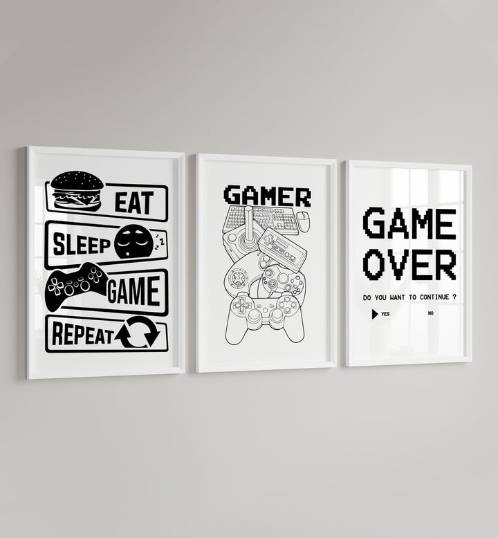 Elevate your space with GAMERS, SET OF 3 PAINTINGS featuring "Eat Sleep Game Repeat" for every avid gamer.
